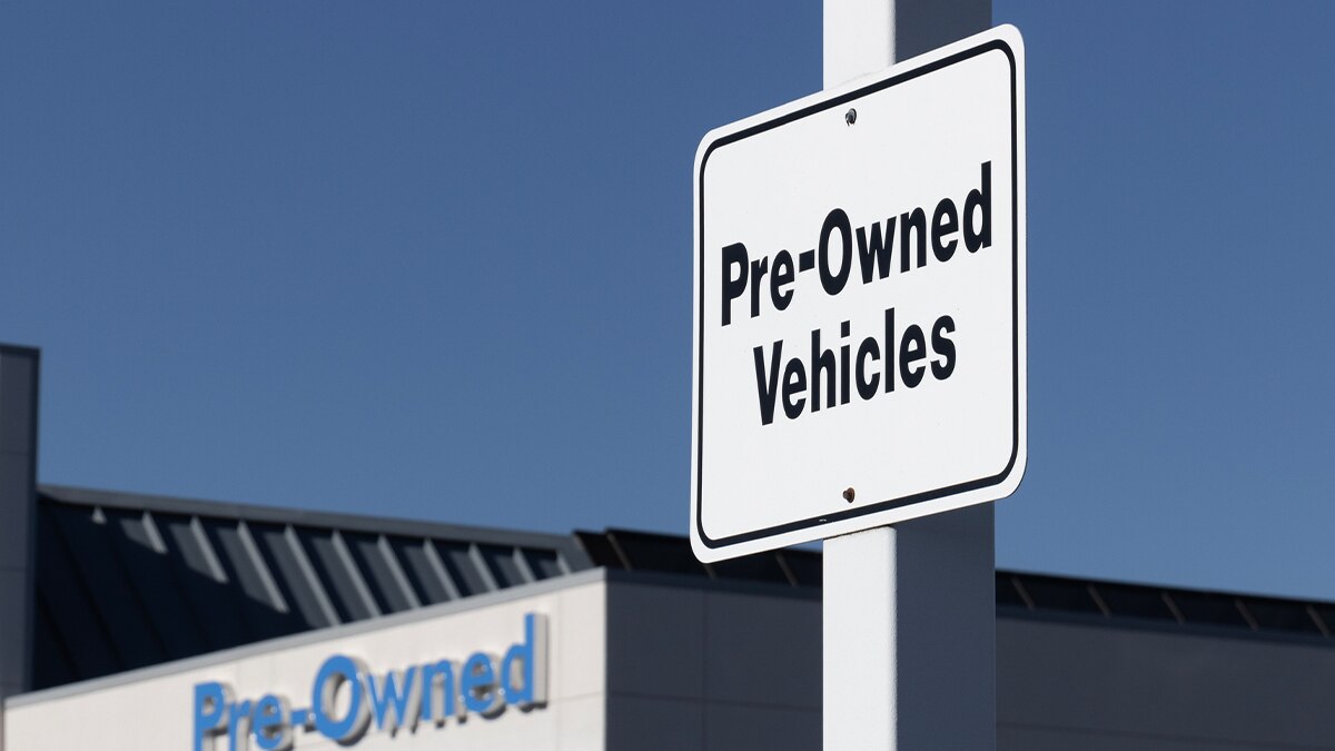 a sign for pre-owned vehicles